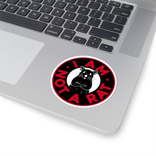 Laptop with a 'I AM NOT A RAT' sticker on the palm rest area